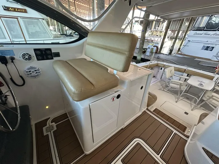 Native Dancer Yacht Photos Pics 2002 Tiara Yachts 3800 Open interior with beige seating and wood flooring.