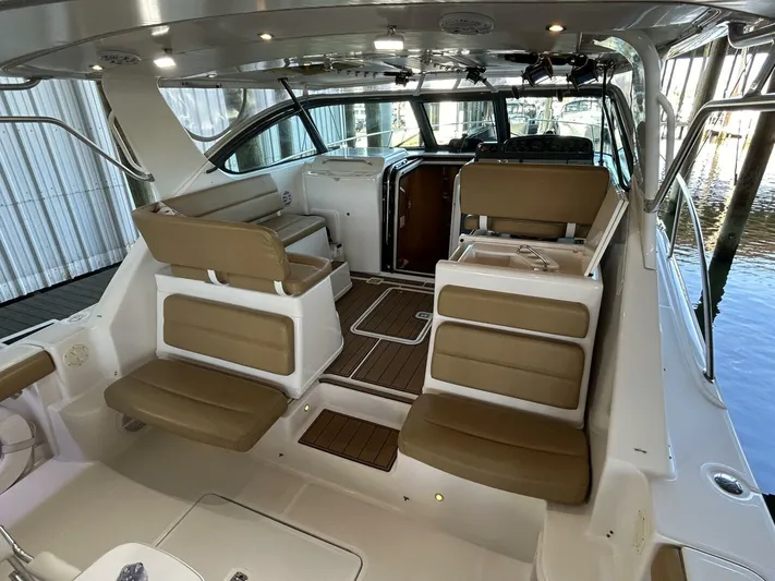 Native Dancer Yacht Photos Pics 2002 Tiara Yachts 3800 Open interior with tan seating and wood flooring.