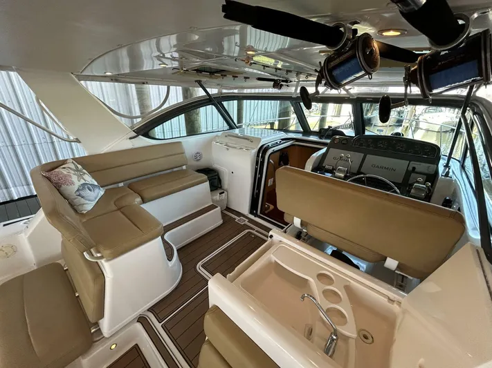 Native Dancer Yacht Photos Pics 2002 Tiara Yachts 3800 Open interior with seating and helm station.