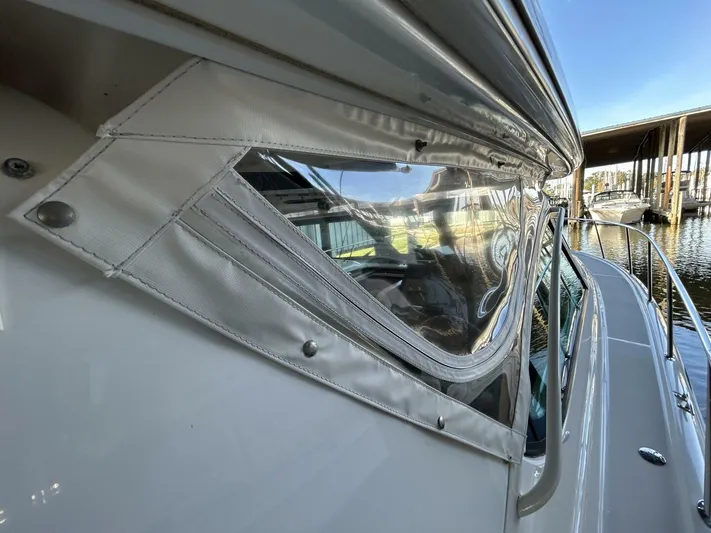 Native Dancer Yacht Photos Pics 2002 Tiara Yachts 3800 Open, side view with clear window, docked at marina.