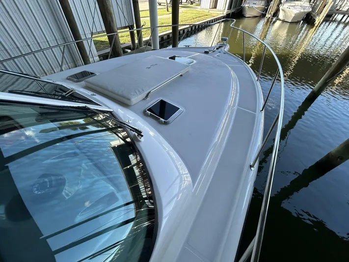 Native Dancer Yacht Photos Pics 2002 Tiara Yachts 3800 Open boat deck, docked in a marina.