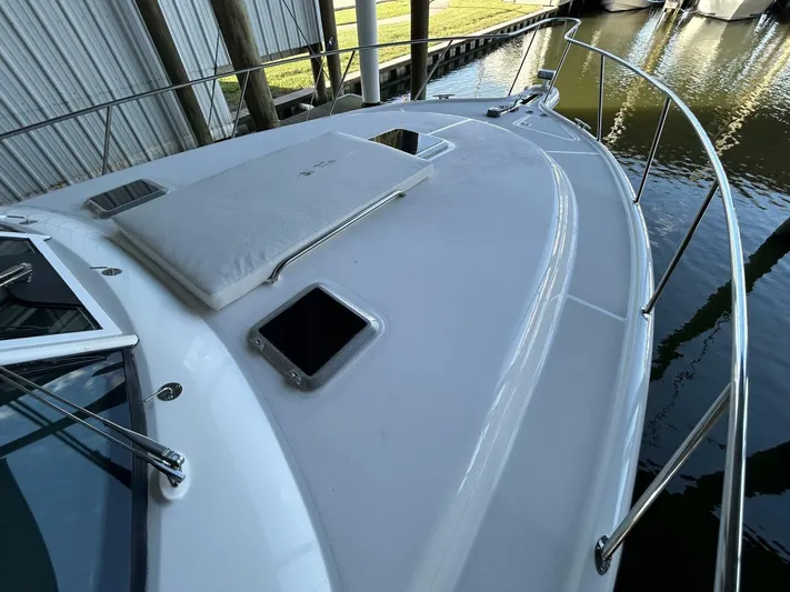 Native Dancer Yacht Photos Pics 2002 Tiara Yachts 3800 Open boat deck with railing and hatches.