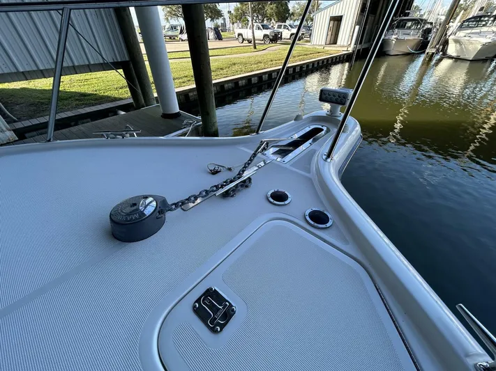 Native Dancer Yacht Photos Pics Bow deck of 2002 Tiara Yachts 3800 Open, featuring anchor chain and cleats.