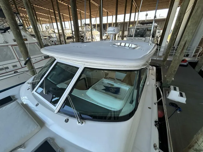 Native Dancer Yacht Photos Pics 2002 Tiara Yachts 3800 Open docked in a marina.