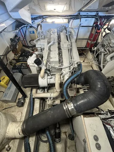 Native Dancer Yacht Photos Pics Engine room of 2002 Tiara Yachts 3800 Open, showcasing detailed mechanical components.