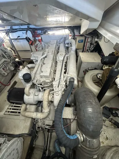 Native Dancer Yacht Photos Pics Engine room of 2002 Tiara Yachts 3800 Open, showcasing detailed machinery and components.