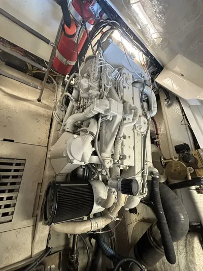 Native Dancer Yacht Photos Pics Engine room of 2002 Tiara Yachts 3800 Open, showcasing detailed machinery and components.