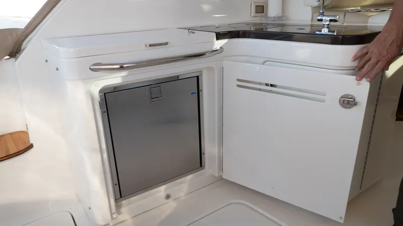  Yacht Photos Pics 2014 Sea Ray 410 Sundancer yacht kitchenette with stainless steel fridge and sink.