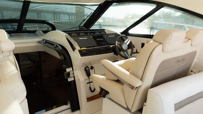  Yacht Photos Pics 2014 Sea Ray 410 Sundancer helm with luxurious seating and modern navigation controls.