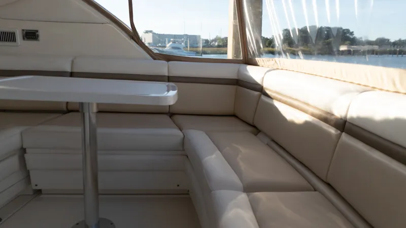  Yacht Photos Pics Interior of 2014 Sea Ray 410 Sundancer yacht with beige seating and table.