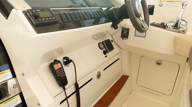  Yacht Photos Pics 2014 Sea Ray 410 Sundancer helm with steering wheel, controls, and communication equipment.