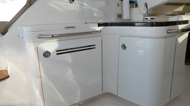  Yacht Photos Pics 2014 Sea Ray 410 Sundancer yacht interior with sleek white cabinetry and modern fixtures.