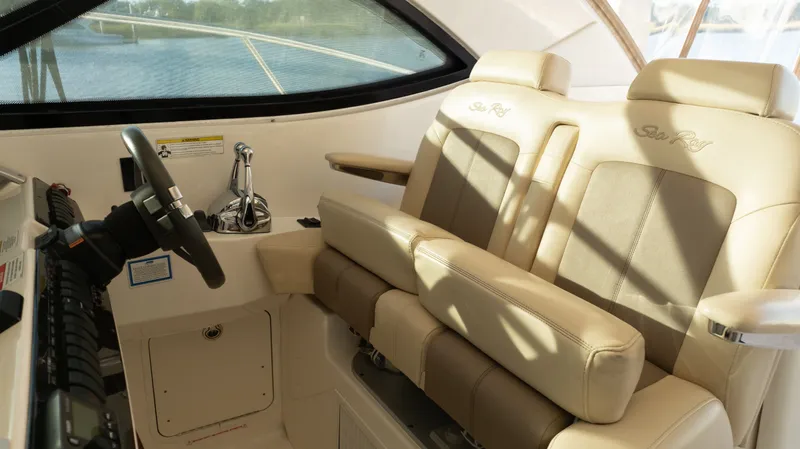  Yacht Photos Pics Luxurious helm seating on 2014 Sea Ray 410 Sundancer yacht, featuring beige leather upholstery.