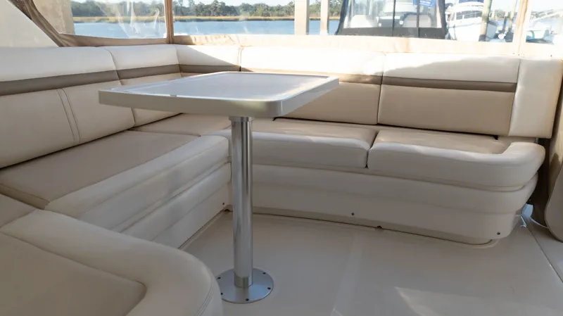  Yacht Photos Pics Luxurious seating area on 2014 Sea Ray 410 Sundancer yacht with elegant table and waterfront view.