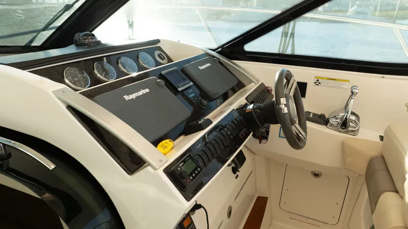  Yacht Photos Pics Helm of 2014 Sea Ray 410 Sundancer with Raymarine electronics and modern controls.