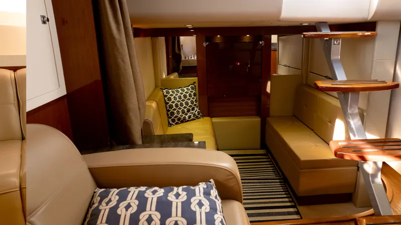  Yacht Photos Pics Luxurious interior of 2014 Sea Ray 410 Sundancer yacht with elegant seating and modern design.