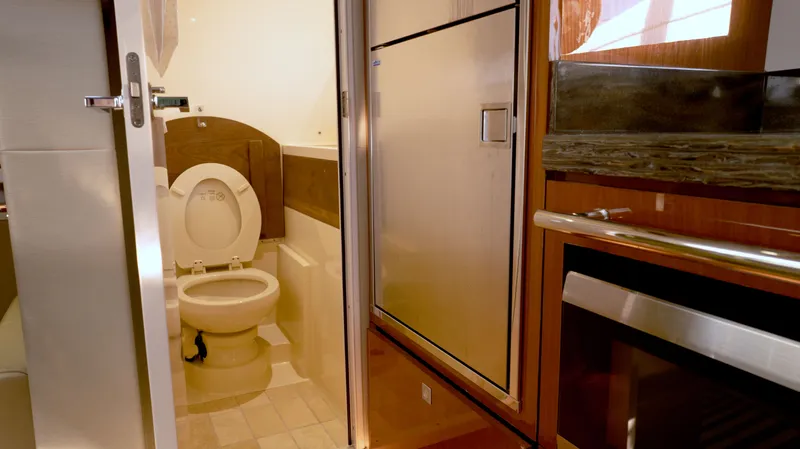  Yacht Photos Pics Interior of 2014 Sea Ray 410 Sundancer yacht showing bathroom and kitchen area.