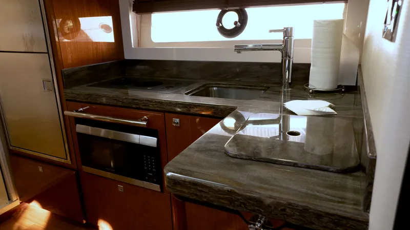  Yacht Photos Pics Luxurious kitchen area in 2014 Sea Ray 410 Sundancer yacht with modern amenities.