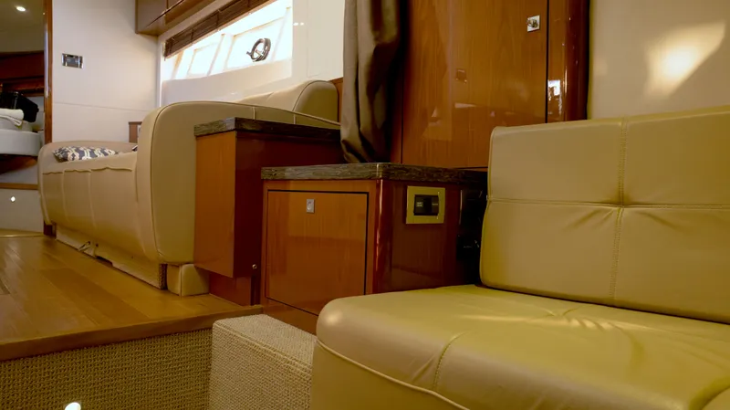  Yacht Photos Pics Luxurious interior of 2014 Sea Ray 410 Sundancer yacht with beige leather seating.