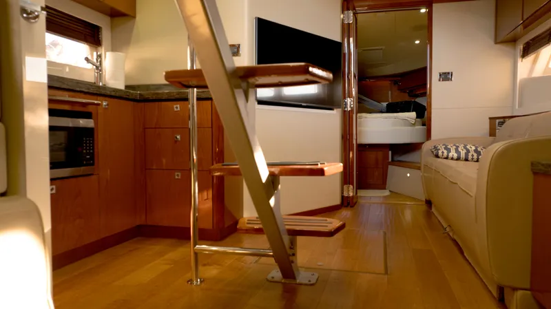  Yacht Photos Pics Luxurious interior of 2014 Sea Ray 410 Sundancer yacht with modern kitchen and cozy seating.