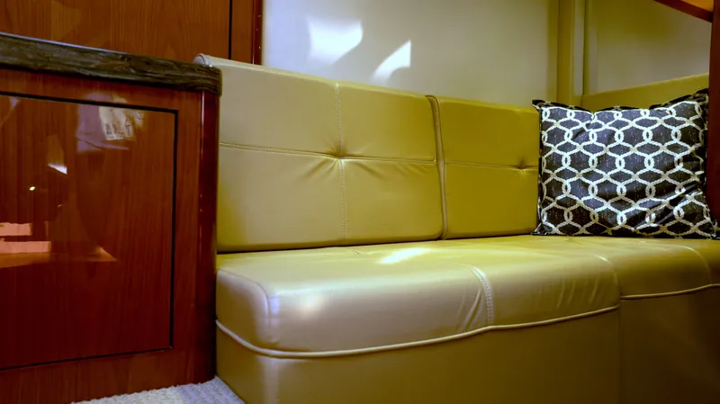  Yacht Photos Pics Luxurious interior of 2014 Sea Ray 410 Sundancer with leather seating and decorative pillow.