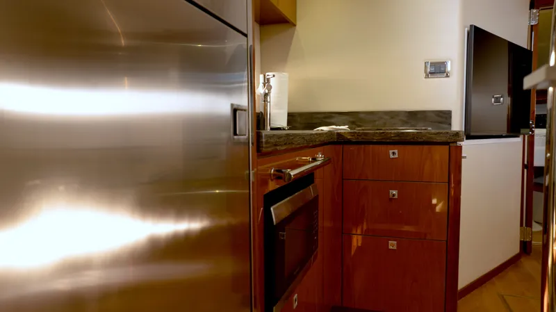  Yacht Photos Pics Luxurious kitchen interior of 2014 Sea Ray 410 Sundancer yacht with modern appliances.