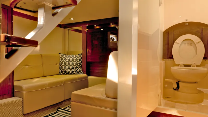  Yacht Photos Pics Luxurious interior of 2014 Sea Ray 410 Sundancer yacht with seating and bathroom.