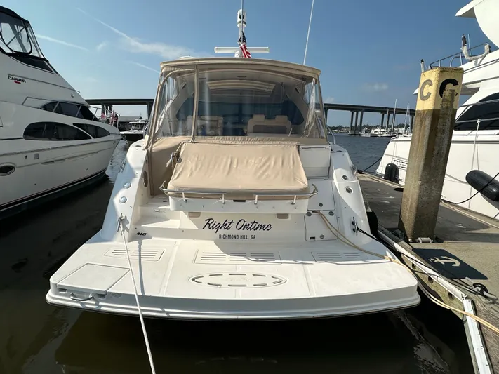  Yacht Photos Pics 2014 Sea Ray 410 Sundancer yacht docked at marina, rear view.