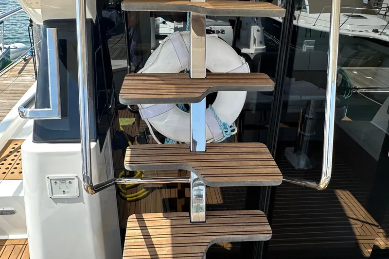 Sweet Yacht Photos Pics Staircase on 2017 Bavaria Virtess 420 Fly yacht with wooden steps and metal railing.
