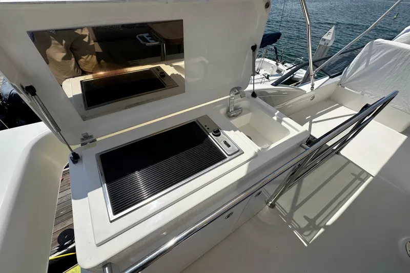 Sweet Yacht Photos Pics Outdoor kitchen on 2017 Bavaria Virtess 420 Fly yacht with sink and grill.