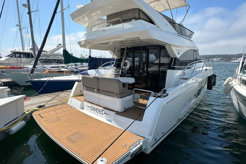 Sweet Yacht Photos Pics 2017 Bavaria Virtess 420 Fly yacht docked in marina, rear view.