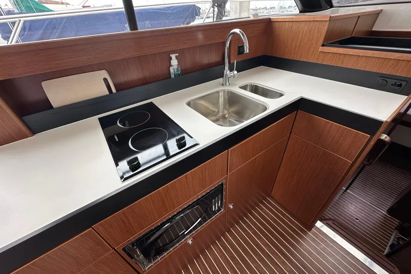 Sweet Yacht Photos Pics Modern kitchen interior of 2017 Bavaria Virtess 420 Fly yacht with stove and sink.