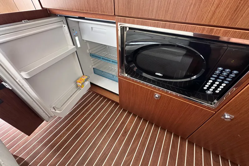 Sweet Yacht Photos Pics Galley of 2017 Bavaria Virtess 420 Fly with open fridge and microwave.