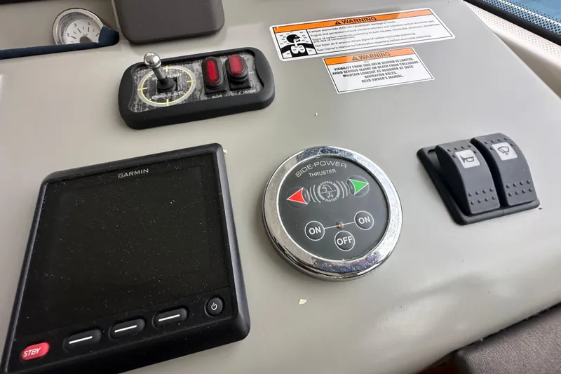 Sweet Yacht Photos Pics Control panel of 2017 Bavaria Virtess 420 Fly yacht with Garmin display and thruster controls.