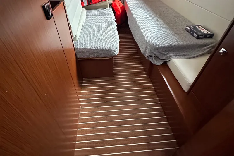 Sweet Yacht Photos Pics 2017 Bavaria Virtess 420 Fly cabin interior with wooden flooring and cozy seating.