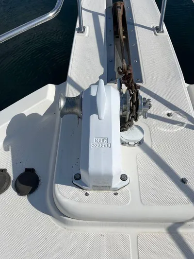 Magna Veritas Yacht Photos Pics 1996 Bayliner 4788 yacht deck with anchor windlass and chain.