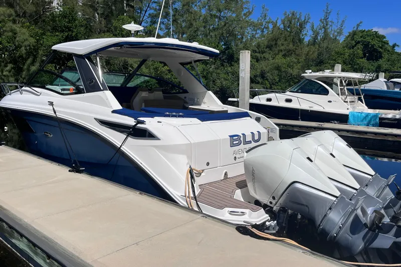 Blu Yacht Photos Pics 2020 Sea Ray Sundancer 320 Outboard docked, featuring sleek design and powerful engines.