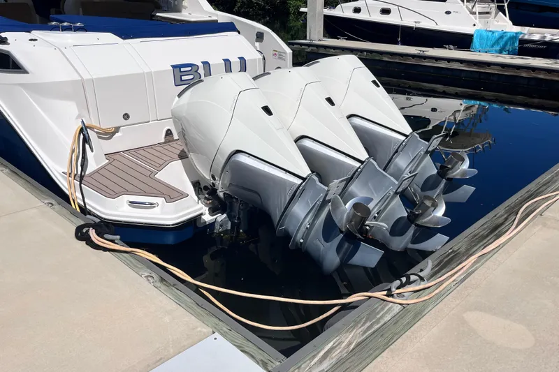 Blu Yacht Photos Pics 2020 Sea Ray Sundancer 320 Outboard with triple engines docked at marina.
