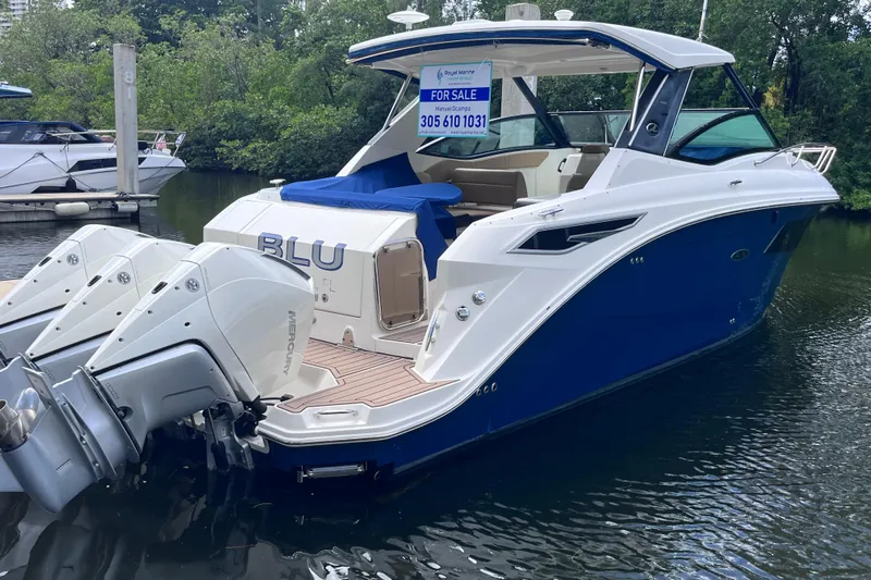 Blu Yacht Photos Pics 2020 Sea Ray Sundancer 320 Outboard boat for sale, docked with triple Mercury engines.