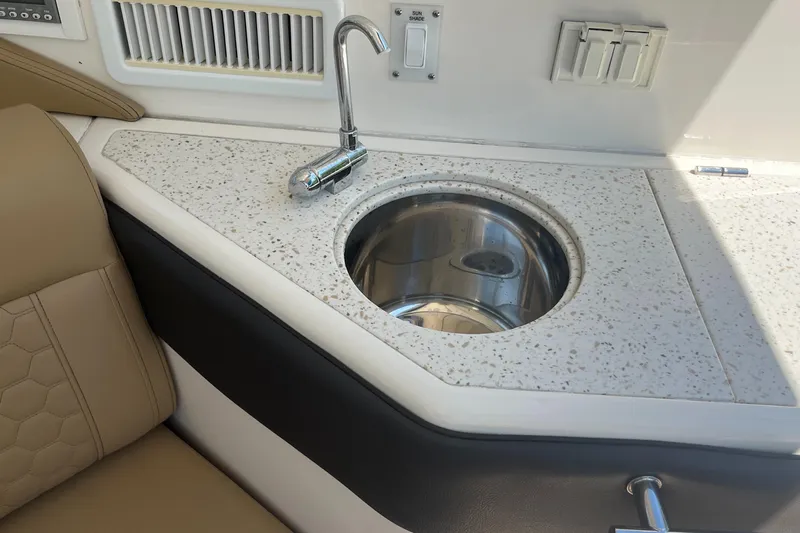 Blu Yacht Photos Pics 2020 Sea Ray Sundancer 320 Outboard boat interior with sink and faucet.