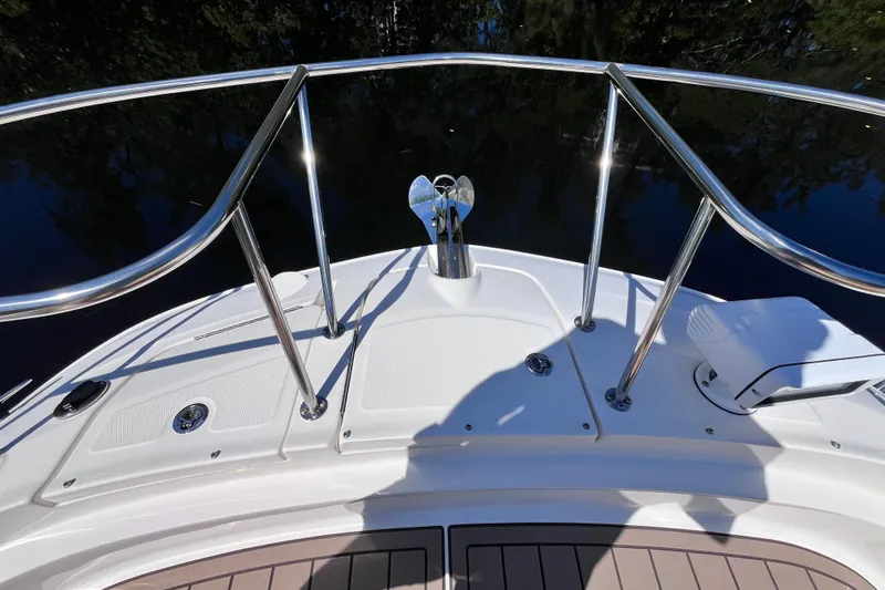 Blu Yacht Photos Pics Bow view of 2020 Sea Ray Sundancer 320 Outboard with stainless steel railings.