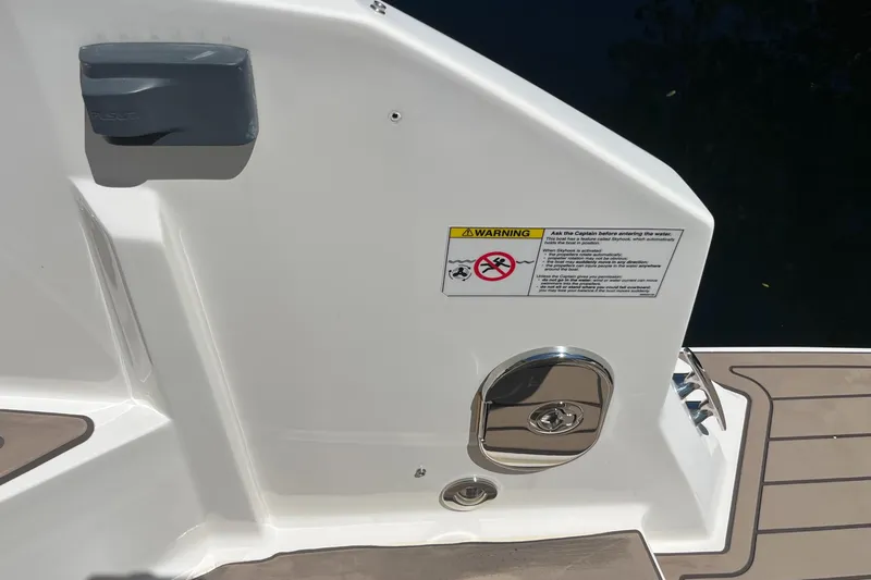 Blu Yacht Photos Pics 2020 Sea Ray Sundancer 320 Outboard boat deck with warning label and hatch.