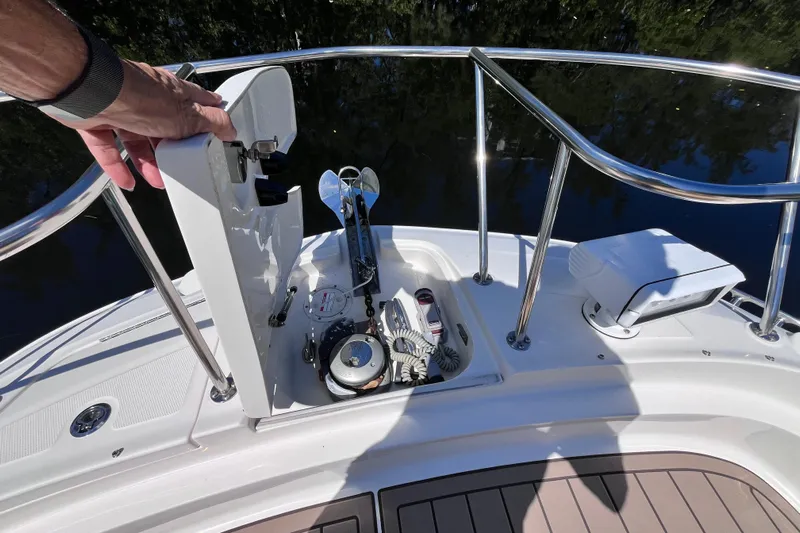 Blu Yacht Photos Pics 2020 Sea Ray Sundancer 320 Outboard anchor compartment with open hatch and railing.