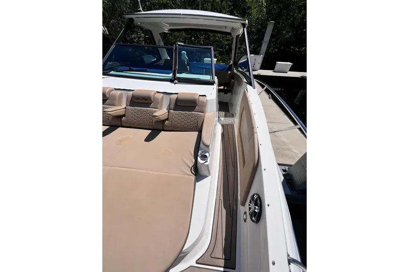 Blu Yacht Photos Pics 2020 Sea Ray Sundancer 320 Outboard, luxurious seating and sleek design, docked at marina.