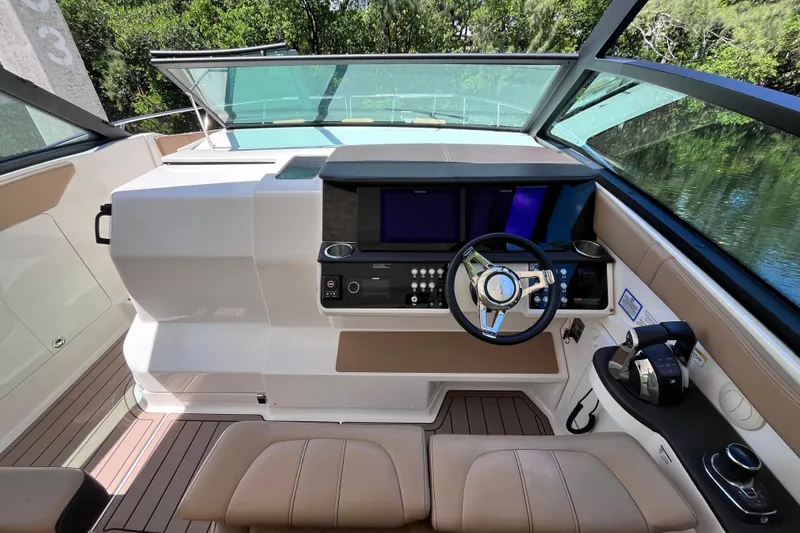 Blu Yacht Photos Pics 2020 Sea Ray Sundancer 320 Outboard helm with modern controls and sleek design.