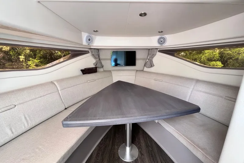 Blu Yacht Photos Pics Interior of 2020 Sea Ray Sundancer 320 Outboard with sleek seating and modern table.