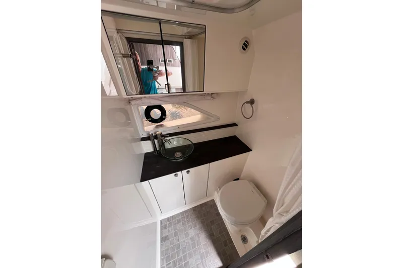 Blu Yacht Photos Pics 2020 Sea Ray Sundancer 320 Outboard bathroom with modern fixtures and compact design.
