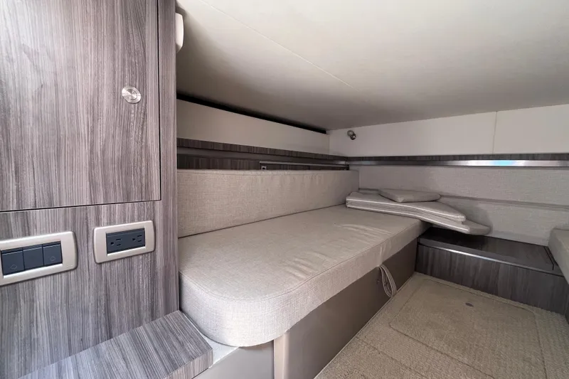 Blu Yacht Photos Pics 2020 Sea Ray Sundancer 320 Outboard cabin interior with modern wood finish and seating.