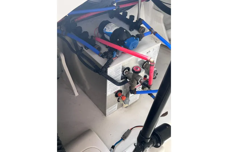 Blu Yacht Photos Pics Engine compartment of 2020 Sea Ray Sundancer 320 Outboard with visible wiring and components.