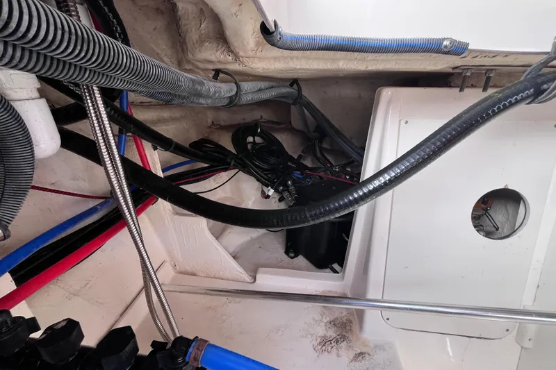 Blu Yacht Photos Pics Engine compartment of 2020 Sea Ray Sundancer 320 Outboard with visible wiring and hoses.